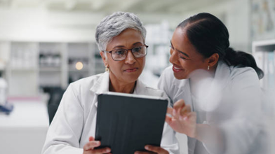 Science research and team of women with tablet for medical study results.png